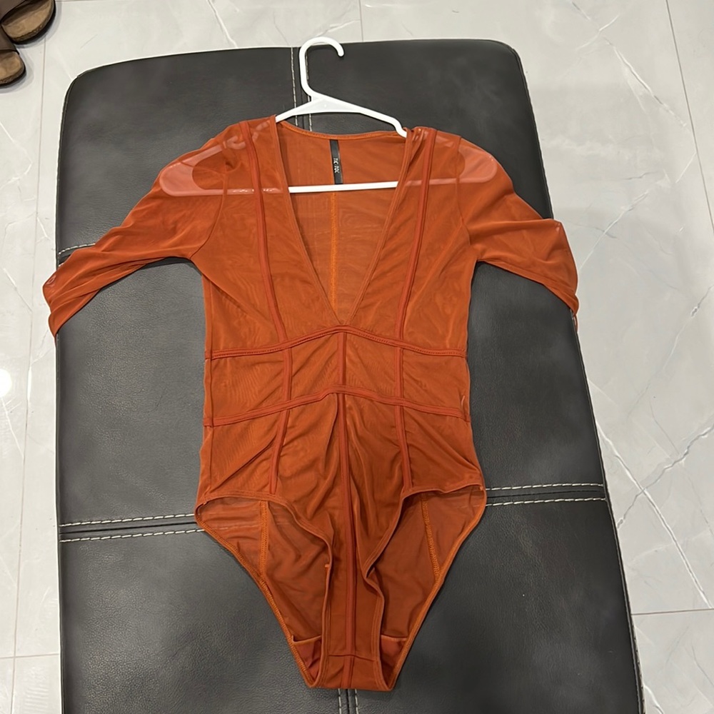 Auburn mesh long sleeve bodysuit. Never worn